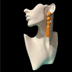 BaubleBar SUGAR FIX golden orange tassel earrings with surgical steel posts.